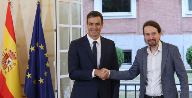 Spain's PM and Podemos leader sign deal for biggest wage hike in 40 years