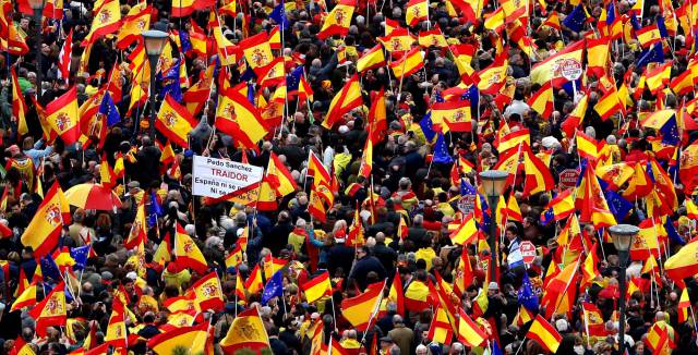 Right-wing parties attract tens of thousands to protest against Spanish PM