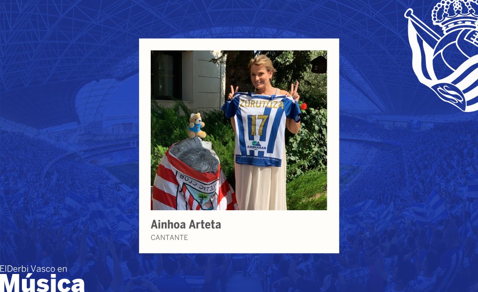 Entre un concierto y el siguiente, recién llegada a mediodía de un ensayo, Ainhoa Arteta (Tolosa, 1964) se detiene a hacerse una fotografía con la camiseta de la Real Sociedad y la bandera del Athletic. Puede verse de las dos formas: ante un derbi, Arteta tendrá siempre el corazón dividido o saldrá siempre victoriosa. Ella es de la Real, pero no quiere menos al Athletic, el equipo de su padre. “Al final son clubes hermanos”, afirma.